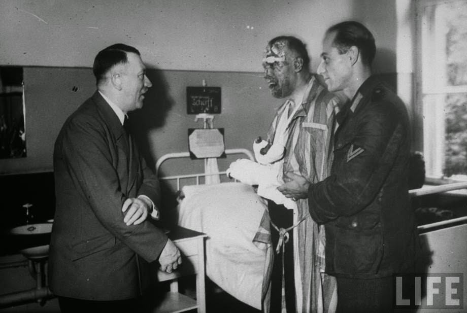 #23 Hitler comes to visit one of the injured officers, after a failed assassination attempt on Hitler, July 20, 1944