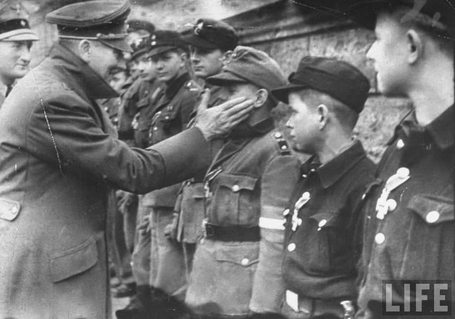 #60 One of the last photo of Hitler. The Fuhrer in the garden of the Reich Chancellery awards the young members of the Hitlerjugend (Hitler Youth) brigade mobilized to defend Berlin