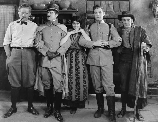 #30 On the set of “Thy Name Is Women”, 1924 with Fred Niblo and co-stars Wallace MacDonald, Ramon Novarro, and William V. Mong.