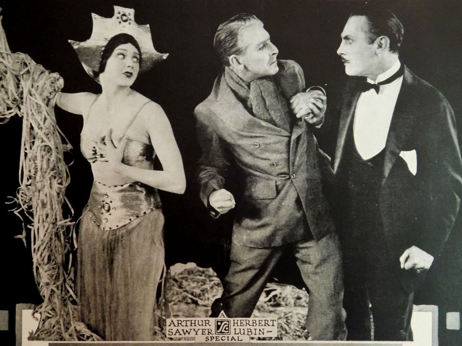 #37 Barbara La Marr with Percy Marmont (center), and Lew Cody (on right) in “The Shooting of Dan McGrew”, 1924
