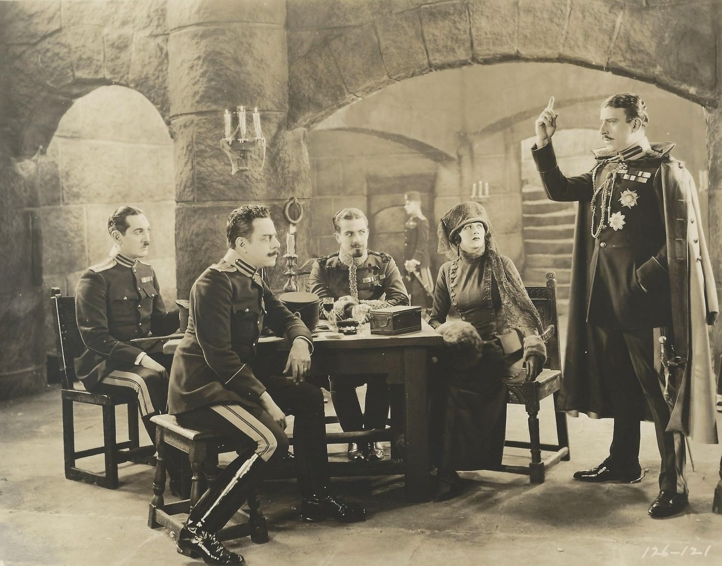 #41 Barbara La Marr in “The Prisoner of Zenda”, 1922 with Stuart Holmes (standing) as Black Michael, and Ramon Novarro (seated, center) as Rupert of Hentzau