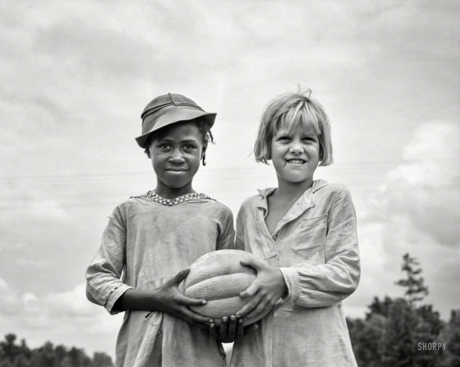 #55 Girls with food for Fourth of July celebration at Delta Cooperative Farm, 1936