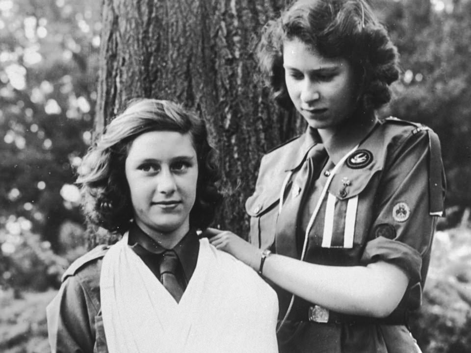 #44 Queen Elizabeth II, right, practices bandaging with her sister, Margaret, 1943