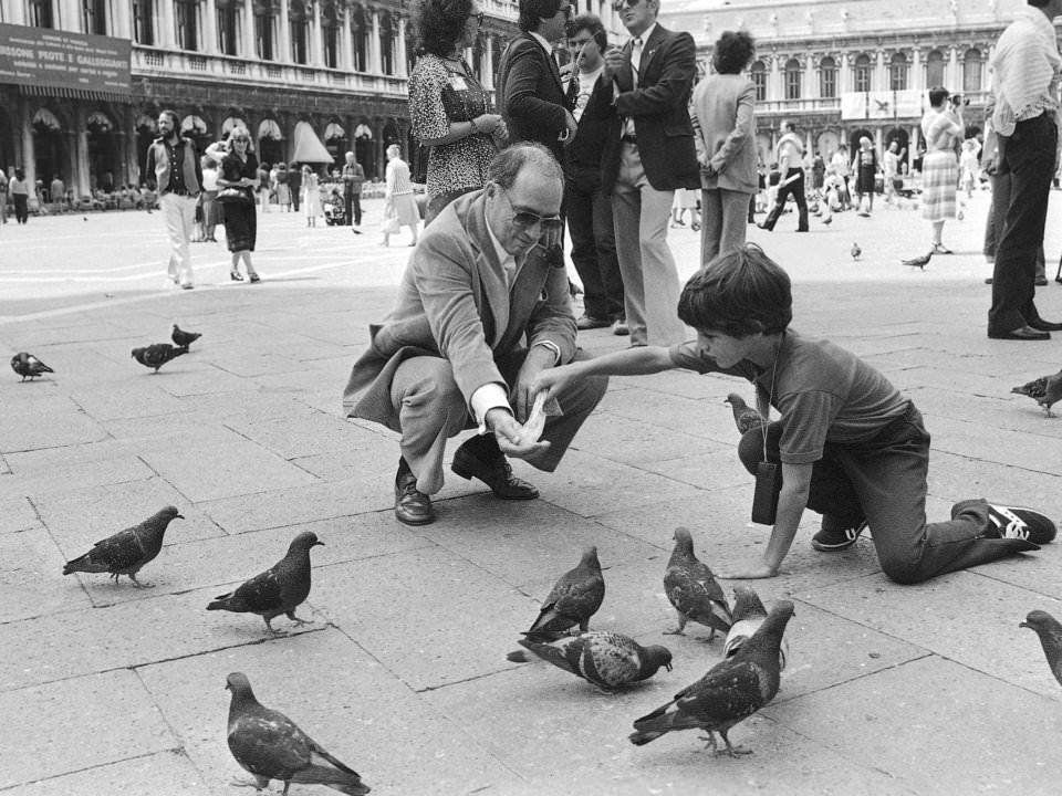 #43 Eight-year-old Justin Trudeau feeds pigeons with his father, 1980