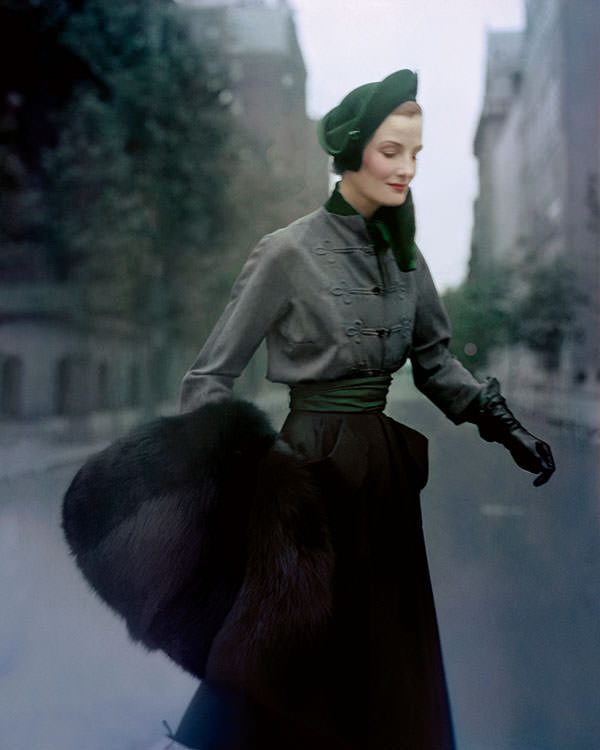 #5 Wenda Parkinson wearing a Christian Dior hussar-style velvet-and-wool tailleur and black-fox muff in Paris, 1949