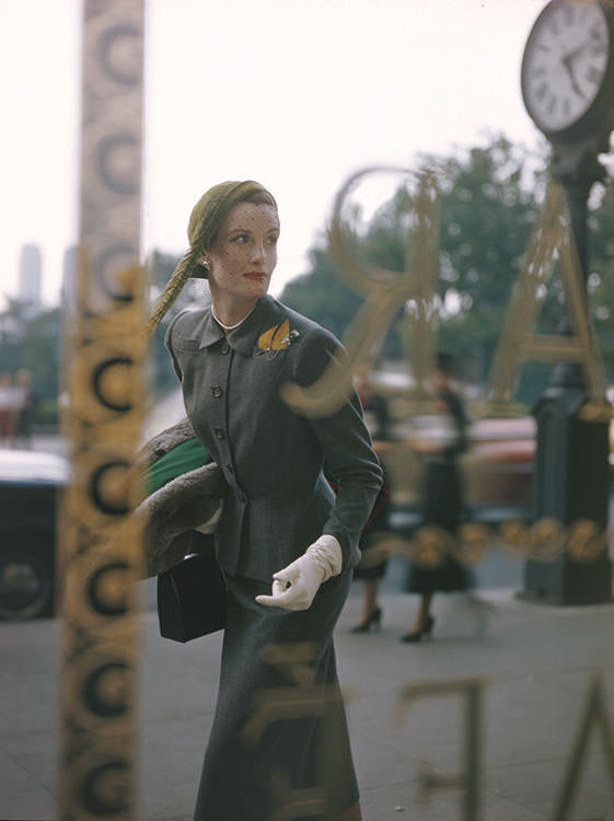 #15 Wenda Parkinson wearing a grey flannel suit and lime-green cap, 1949