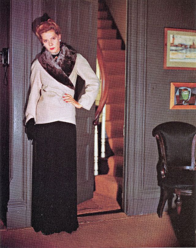 #20 Shirt top and pencil-skirt in printed wool-rayon crepe with belt and buttons in blond calf by Traina-Norell, panama hat by John Frederics, May 1944