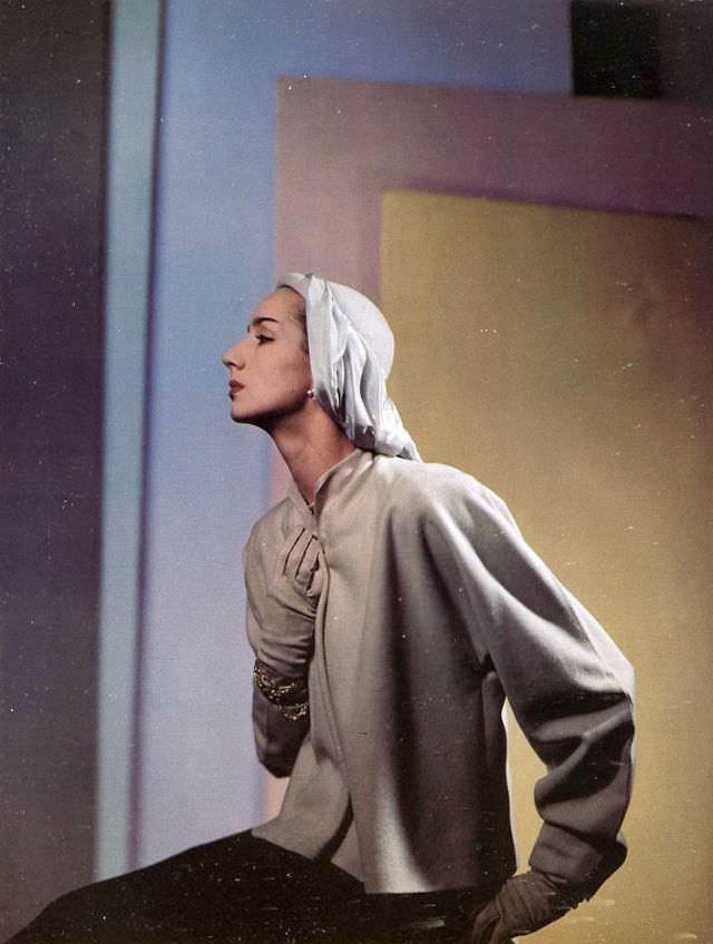 #26 Toni Hollingsworth in a coat by Roxspun, hat by John Frederics, August 1945