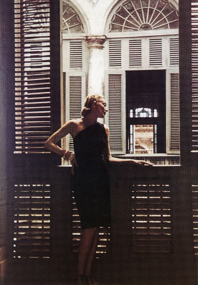 #4 Model in a Nettie Rosenstein suit with brooch by Tiffany worn at the waist, 1941