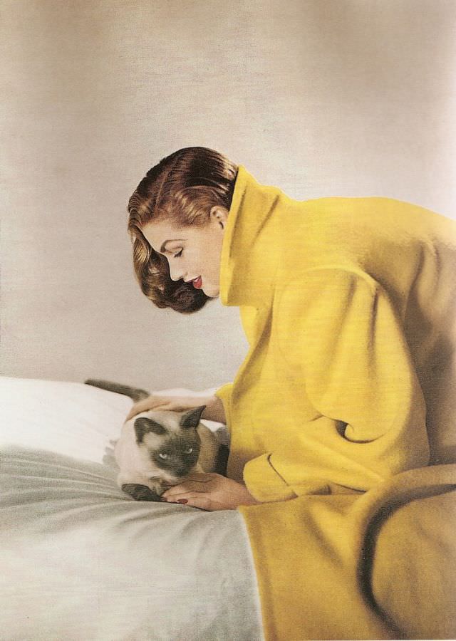#34 Inga is wearing a yellow wool coat by Original Modes, January 1947