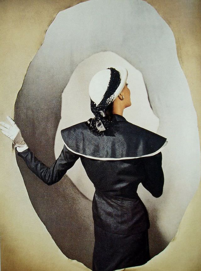 #39 Model is wearing suit and hat by Hattie Carnegie, Louise Dahl-Wolfe’s studio, March 1947