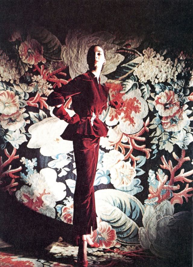 #51 Models in two evening dresses by Adrian feature painterly starfish prints and demure eyelet ruffles, 1948
