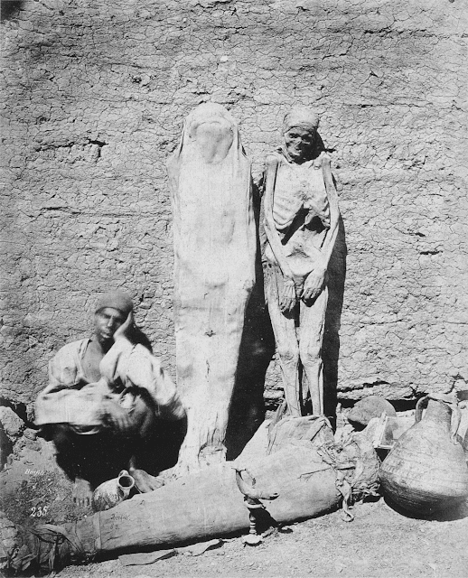 #1 A street Vendor selling Mummies, 1875