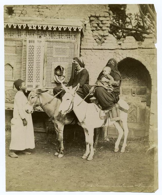 #52 Women riding on their donkeys