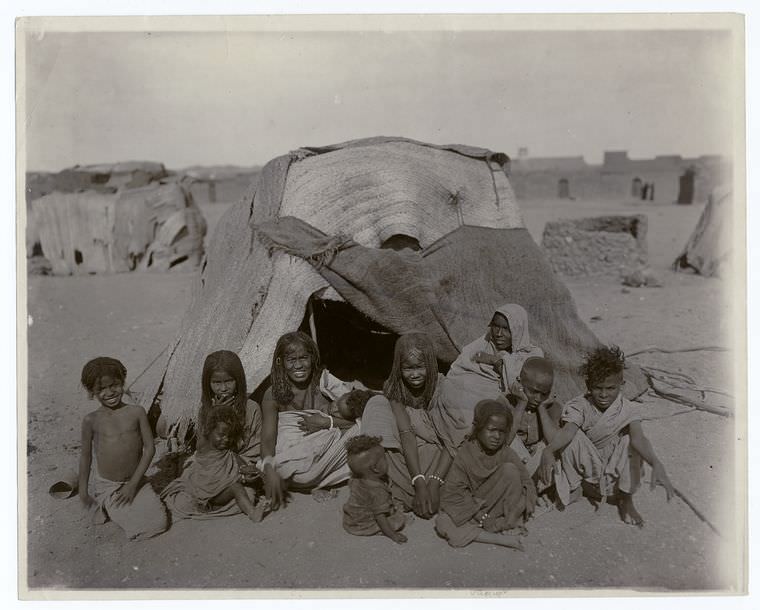 #56 A group of Bisharin before their tent at Wady Halfa, Egypt