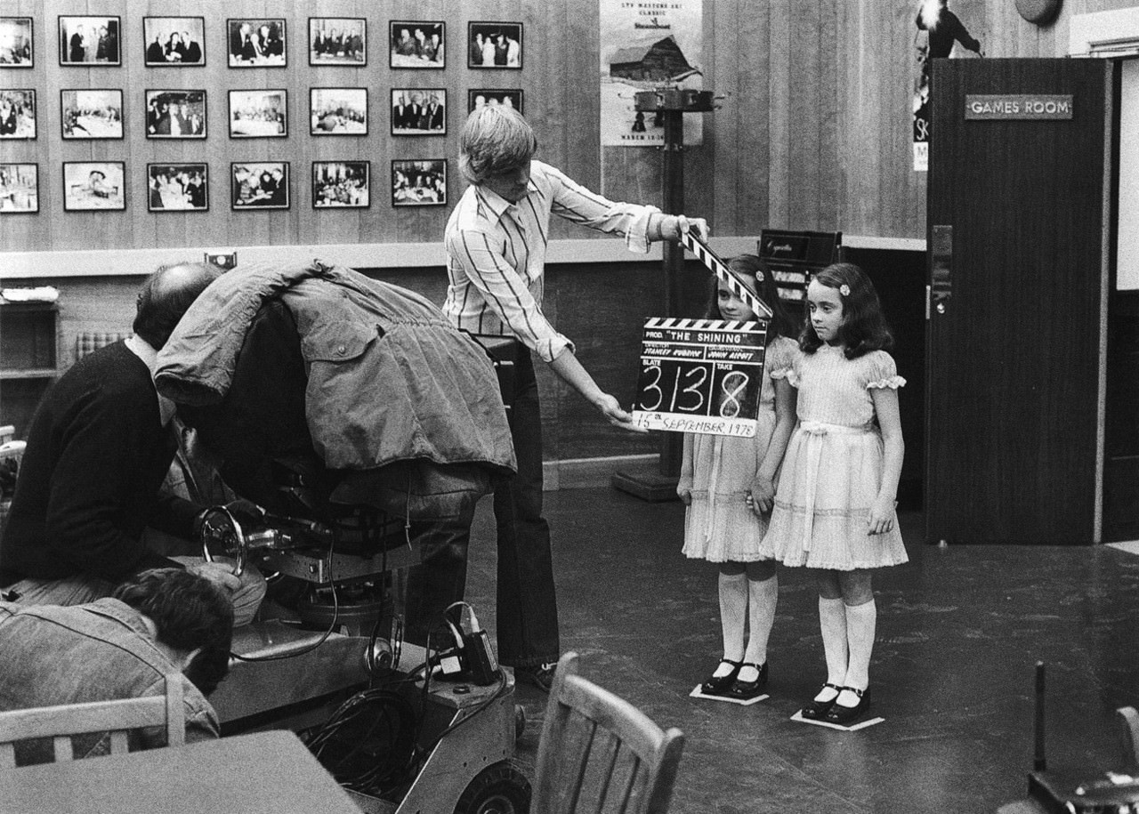 #12 Lisa and Louise Burns, who portrayed the Grady Sisters, prepare for a shot on the games room set. Kelvin Pike operates the camera and Camera Assistant Peter Robinson holds the slate.