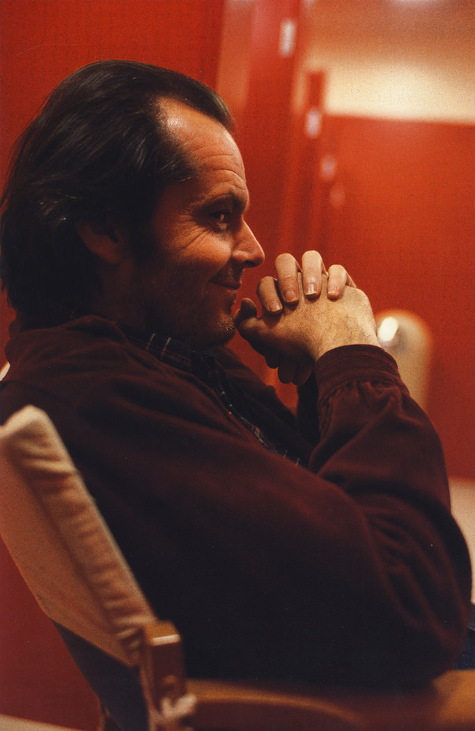 #24 Jack Nicholson, (in reflection) Stanley Kubrick and daughter, Vivian, on set.