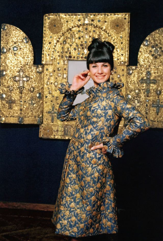 #30 Mickey in peacock blue and gold brocade evening coat, Elle, October 1964
