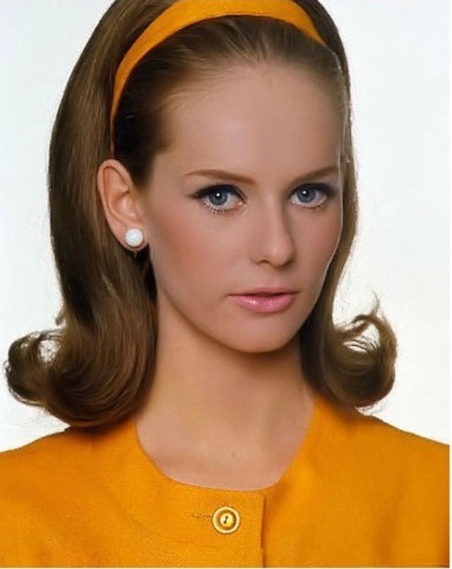 #33 Agneta Frieberg wearing Germaine Monteil makeup and an orange dress by Sloat with matching headband, June 1965