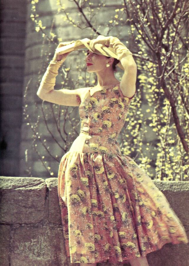 #9 Bettina poses in an embroidered dress by Lempereur, photo Elle, May 30, 1955