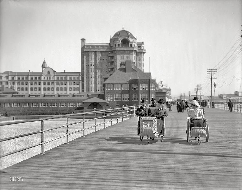 #34 The Jersey shore circa 1906. Rolling chairs on the Boardwalk, Atlantic City. Hotel Traymore in the background.