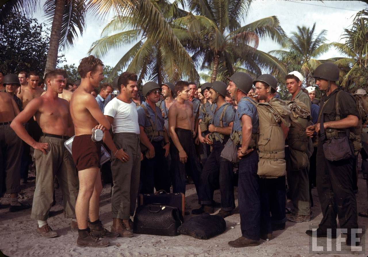 #17 Two groups of American servicemen chatting on Tarawa during WWII.