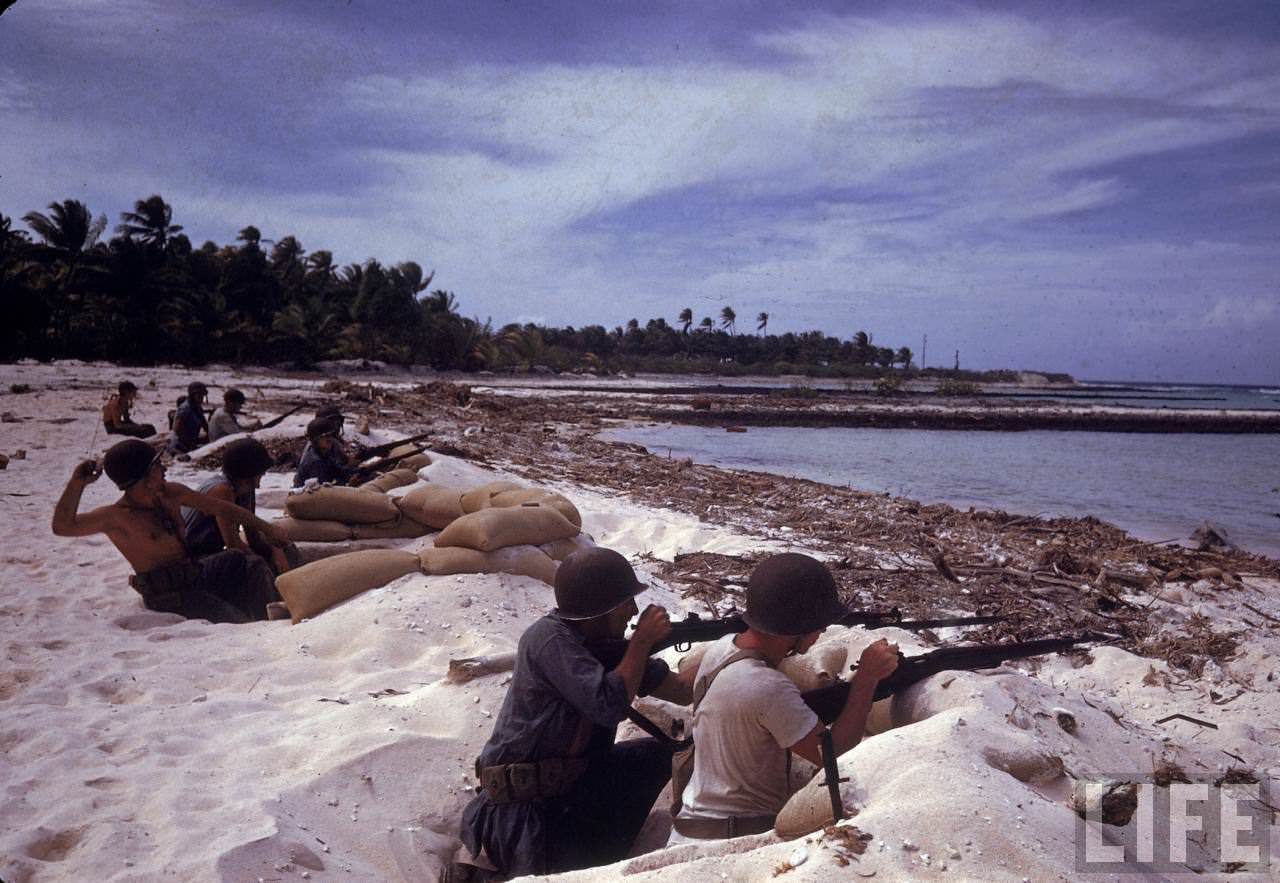 #1 American soldiers manning gun nests protecting the island shore during WWII.