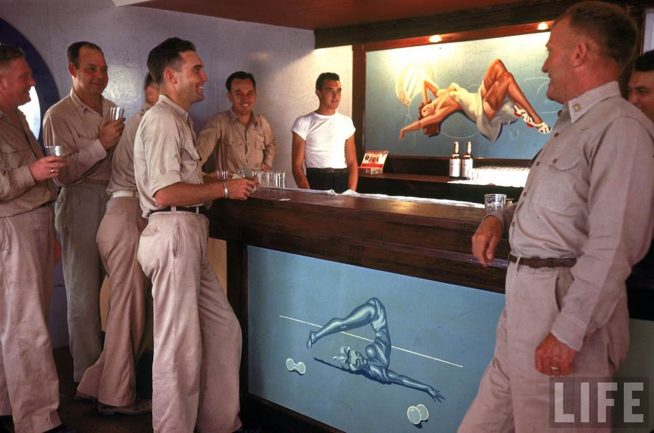 #30 US servicemen enjoying a drink in an Officer’s Club on Tarawa during WWII.