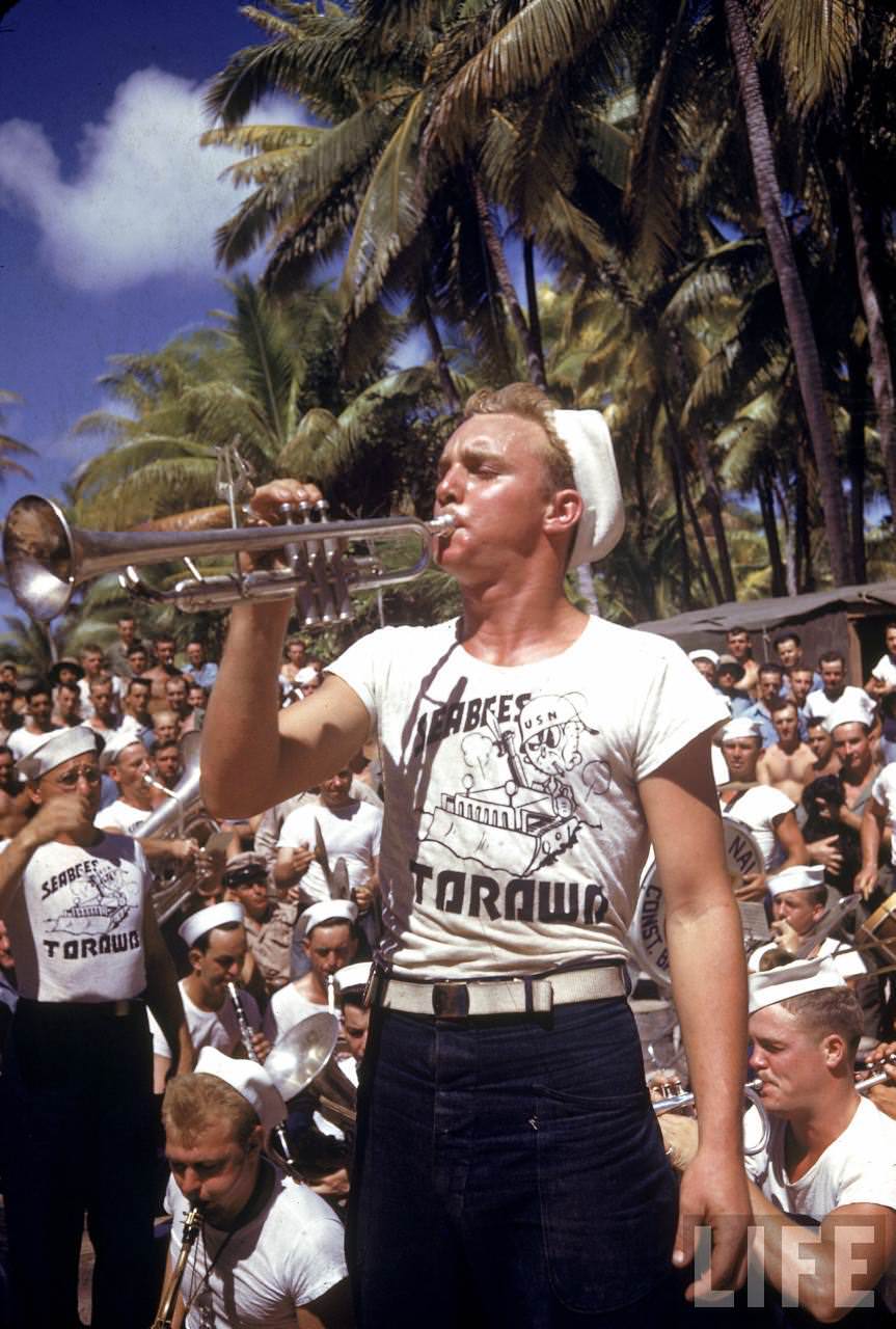 #31 Trumpet playing Nvay seabee taking part in an impromptu concert for the troops stationed on the island during WWII.