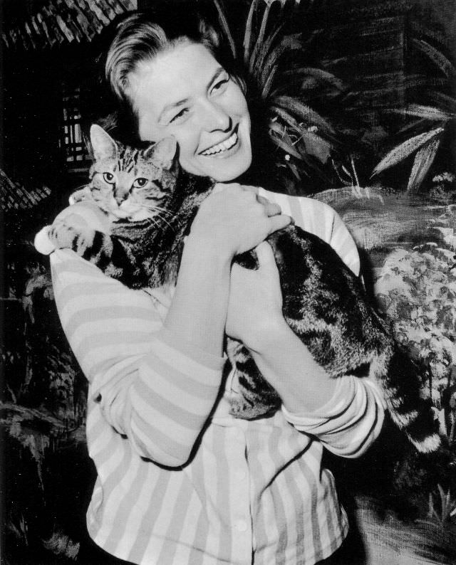 #12 Ingrid Bergman hugging cat while on filming set at Elstree, England, 1958