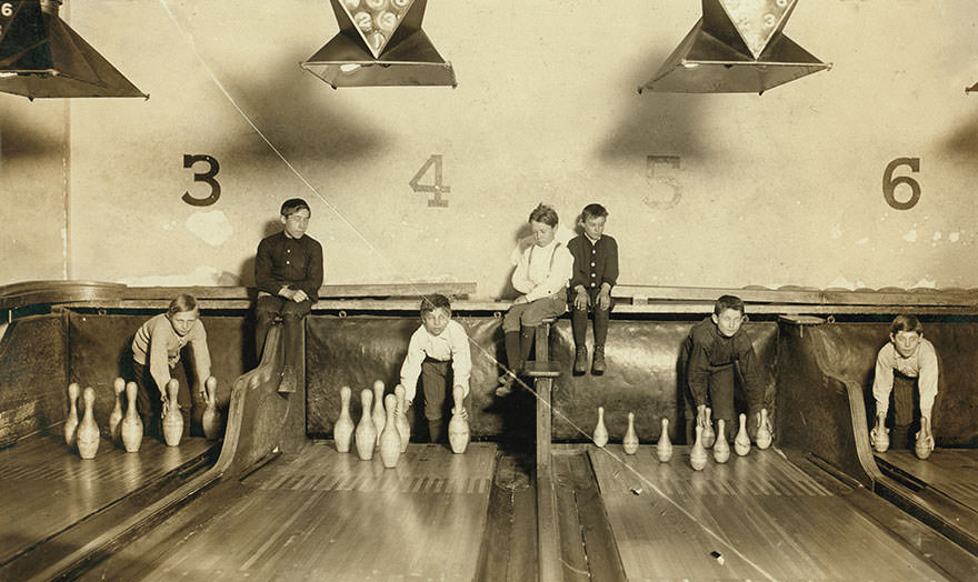 #4 Photo of boys working in arcade bowling alley, Trenton, n.j. Photo taken late at night. The boys work until midnight and later. Location: Trenton, new jersey