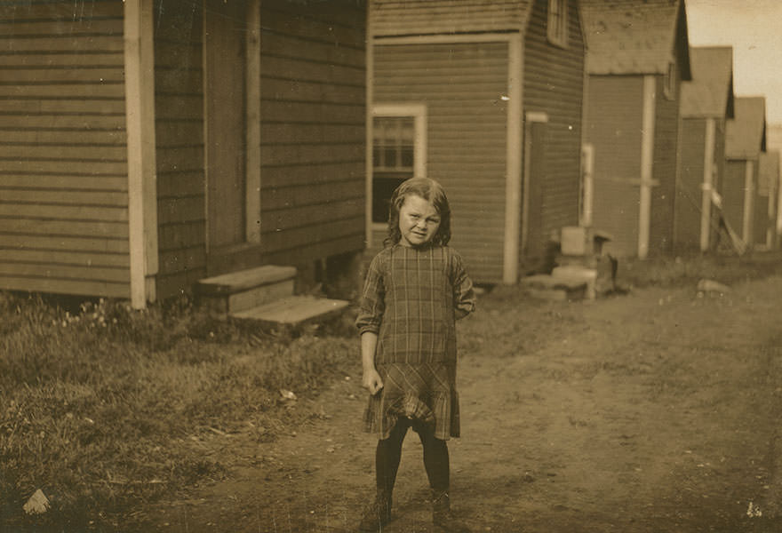 #51 Elsie Shaw, a 6 year old cartoner during the summer. [her father] asked me to take some photos of her, as he has her do a singing act in vaudeville in the winter, “and she’s old enough now to go through the audience and sell her own photos.” Location: Eastport, Maine