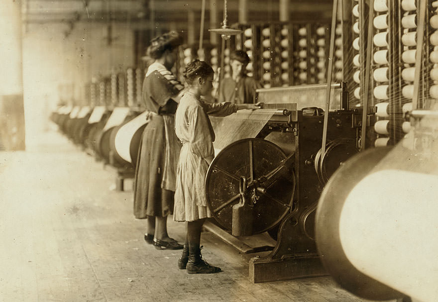#77 Girls running warping machines in loray mill, Gastonia, n.c. Many boys and girls much younger. Location: Gastonia, North Carolina