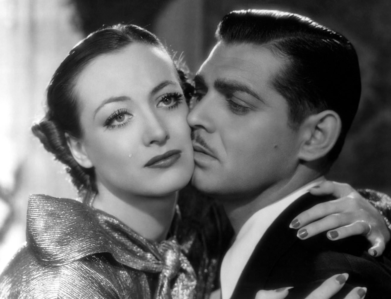 #19 Joan Crawford and Clark Gable in Chained, 1934