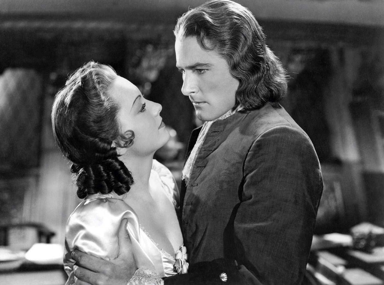 #59 Olivia De Havilland and Errol Flynn in Captain Blood, 1935