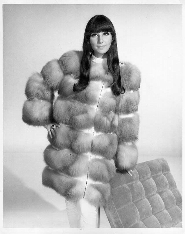 #4 Cher poses for a portrait wearing a fur coat. Photo by Michael Ochs Archives, 1966