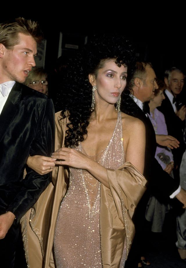 #26 Cher with Val Kilmer at the 56th Annual Academy Awards. Photo by Ron Galella, 1984