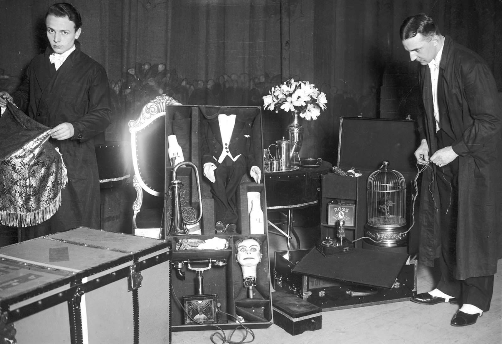 A pair of entertainers unpacking their “dummy” friend in 1925