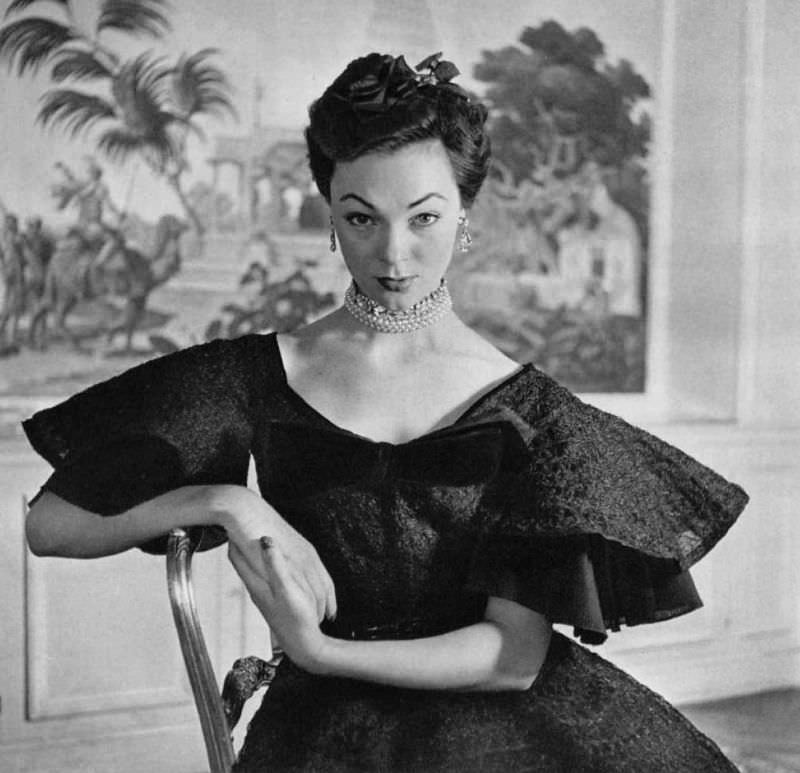 #2 Ivy Nicholson in crimped lace cocktail dress with very full skirt, velvet bow at the neckline, by Jacques Fath, 1951