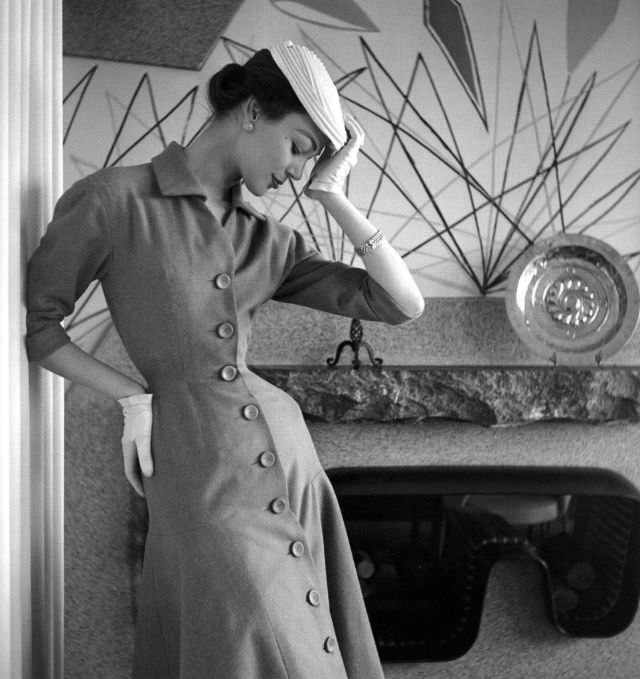 #25 Ivy Nicholson in a princess-line dress of tobacco jersey by Jacques Fath, Nouveau Femina, March 1954
