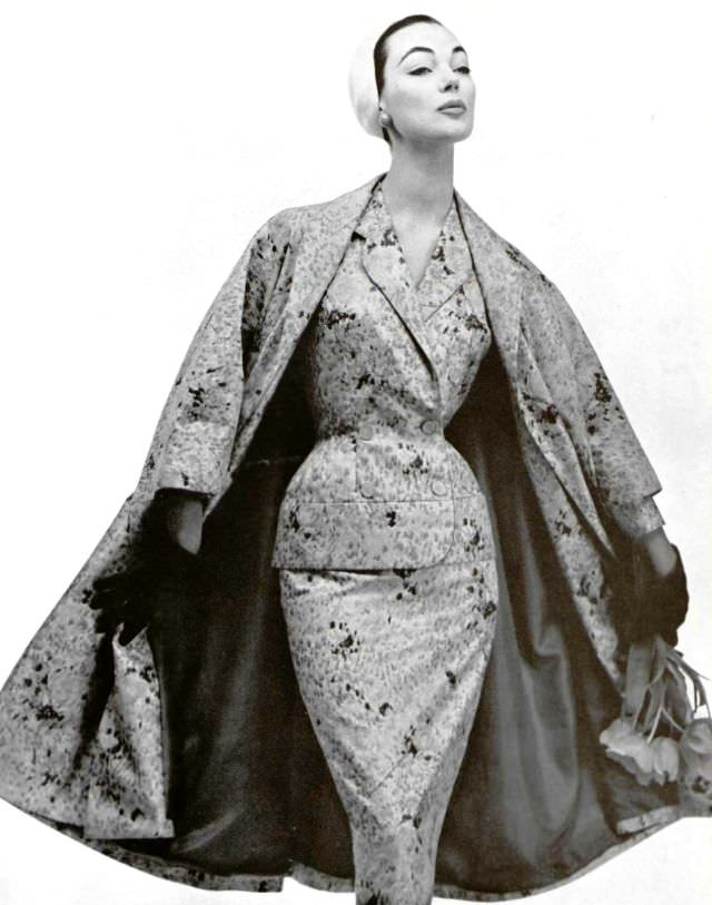 #38 Ivy Nicholson in satin print suit and matching coat by Nina Ricci, 1955