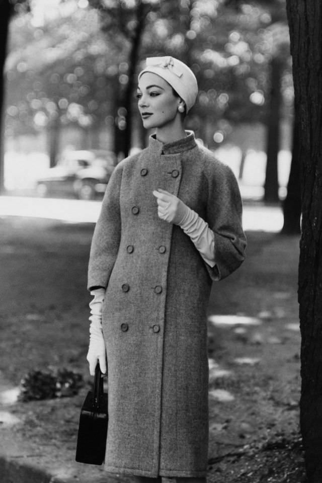 #40 Ivy Nicholson wearing Balenciaga double-breasted mandarin collar coat, 1955