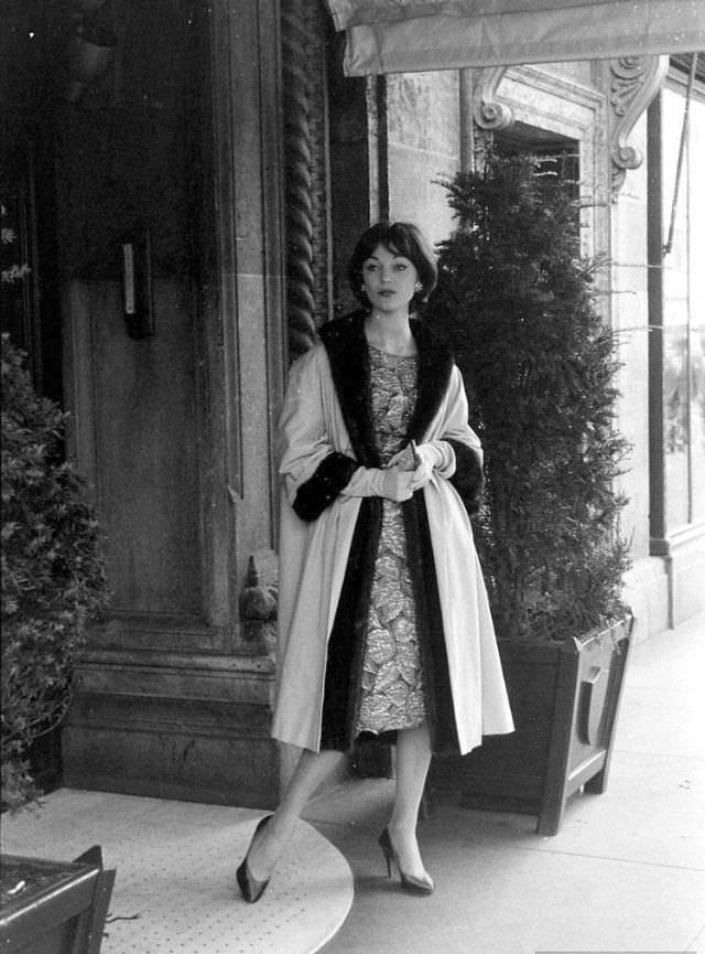 #45 Ivy Nicholson wearing gold brocade sheath worn with a fur-lined evening coat, 1957