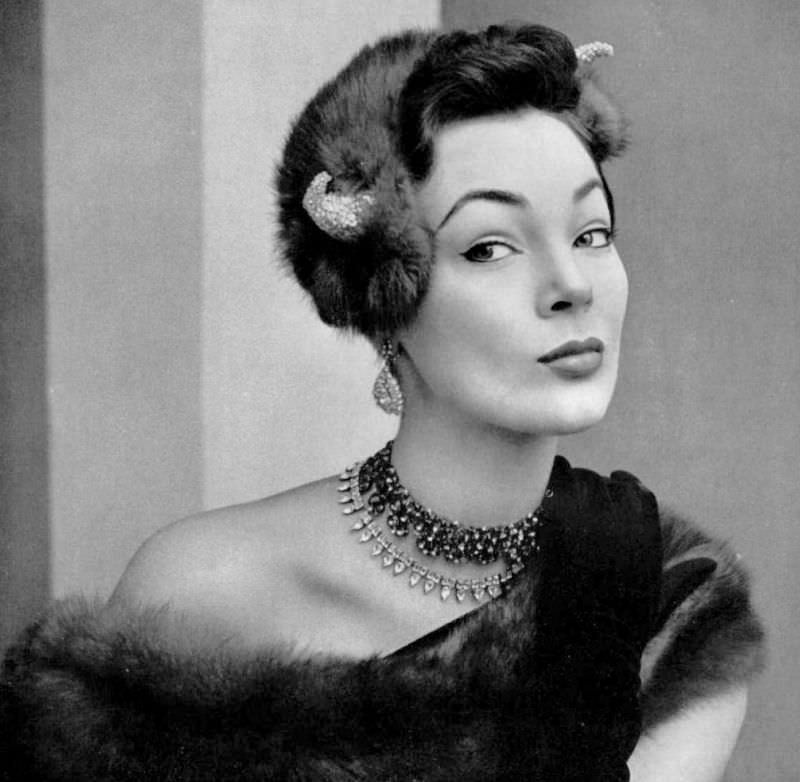 #5 Ivy Nicholson in sable cap with a silver embroidered horn on each side by Gilbert Orcel, costume jewelry also by Gilbert Orcel, 1951