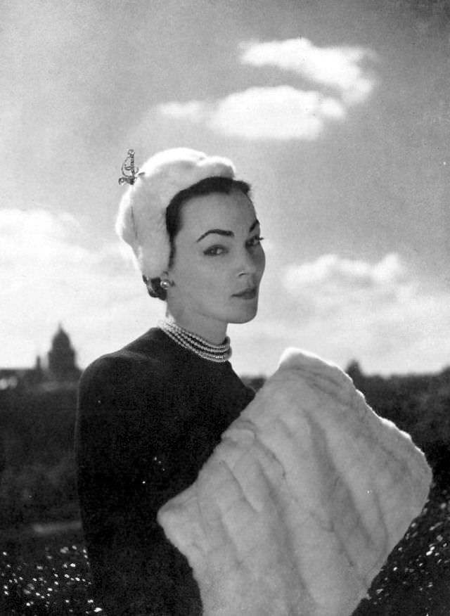 #8 Ivy Nicholson in white ermine cap by Legroux, ermine muff by Maurice Kotler, 1951