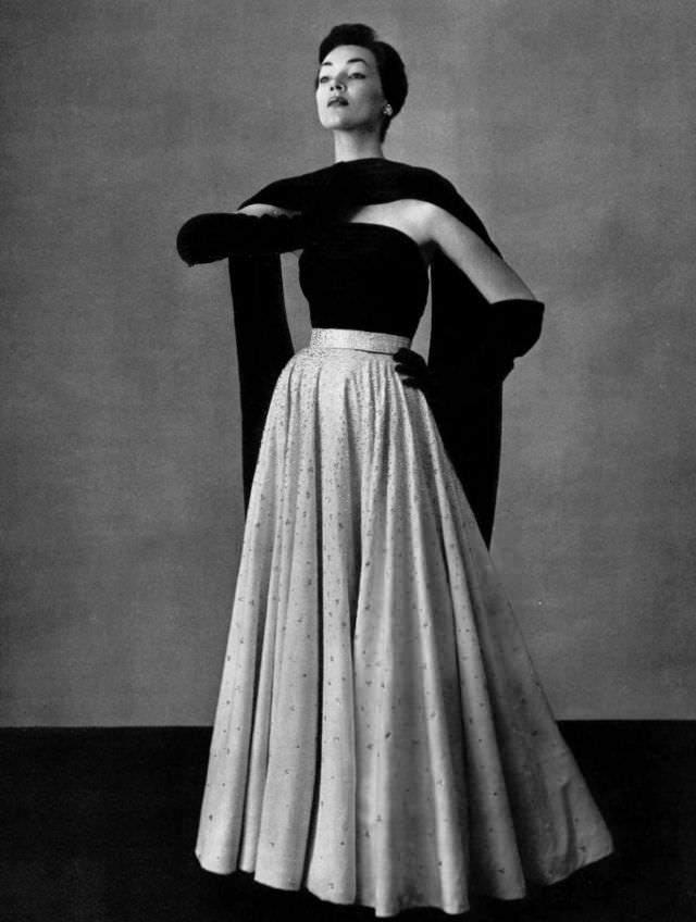 #9 Ivy Nicholson in white velvet skirt embroidered with beads worn with navy jersey top and stole, by Jean Dessès, 1951