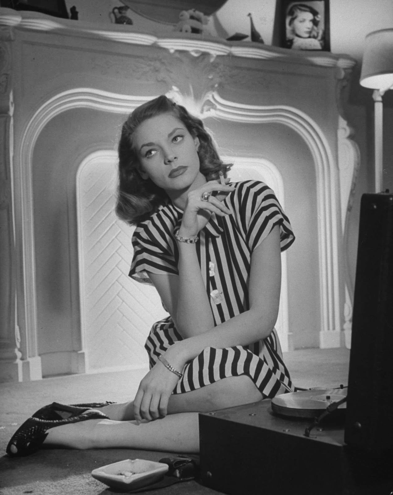 #20 In 1945, she showed off a customary combination: striped tailored dress, smart wedges, and a cigarette.