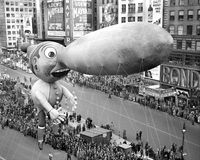 Balloons float down Broadway in thirteenth annual Macy’s Thanksgiving Day parade, November 25, 1937.