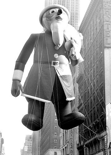 The Macy’s Thanksgiving Day parade crowd watches the Santa Claus balloon in 1939.
