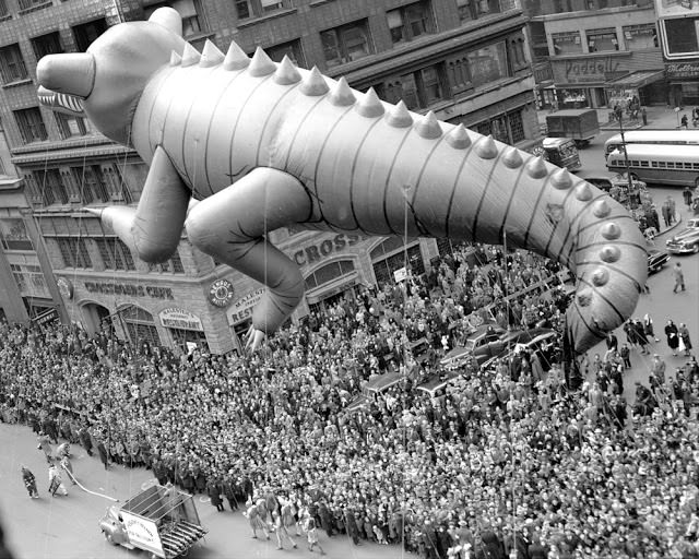 A helium-filled alligator is hauled through Times Square during Macy’s Thanksgiving Day parade in 1949. The parade drew an estimated 2,000,000 spectators.